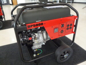 A red portable generator on a dolly kit with a battery inside a showroom