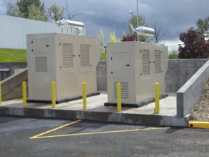 Two generators with exhaust pipes next to each other