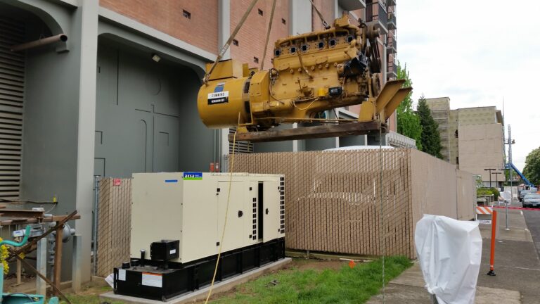 A large industrial generator being replaced by a modern standby generator.