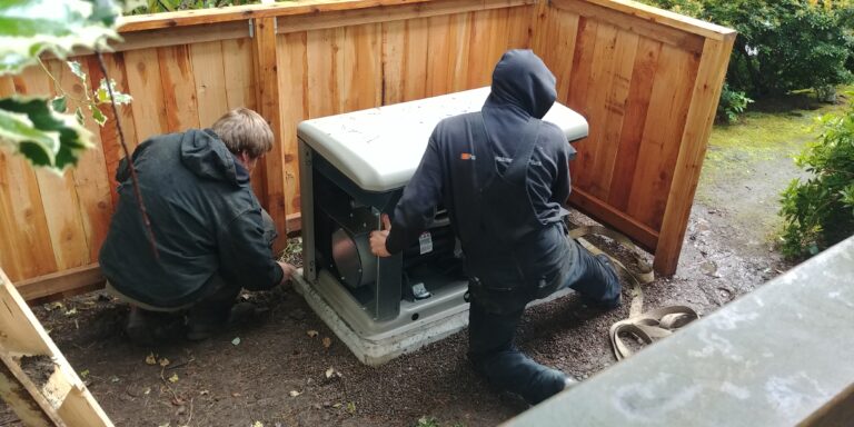 Two technicians installing a home generator in Oregon