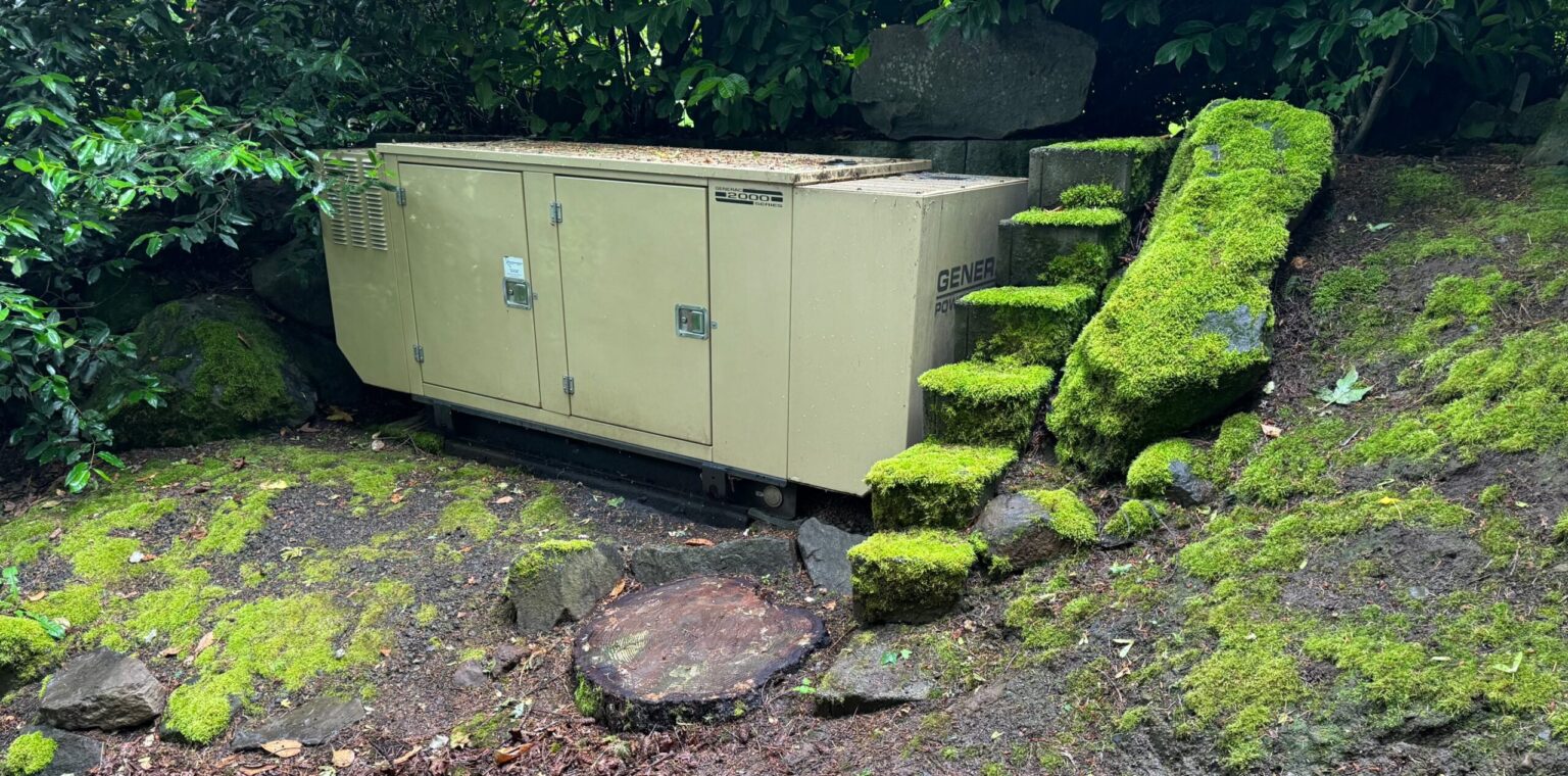 A generac standby generator in a rural backyard.