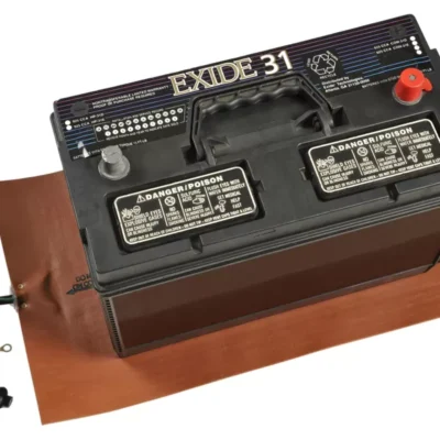 A battery on top of an orange battery heating pad from Hotstart Thermal Management