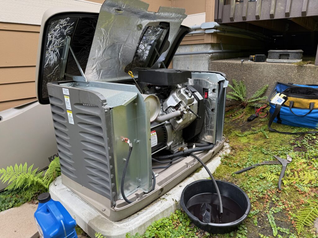 A Kohler home generator having its oil drained during maintenance