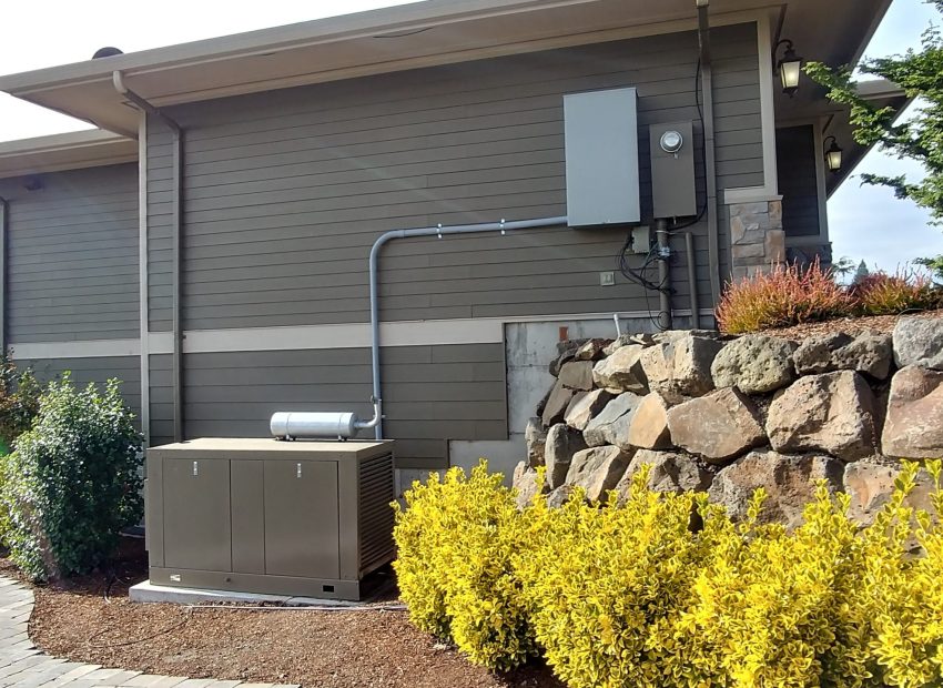 A backup generator installed on the side of a home for emergency power supply.